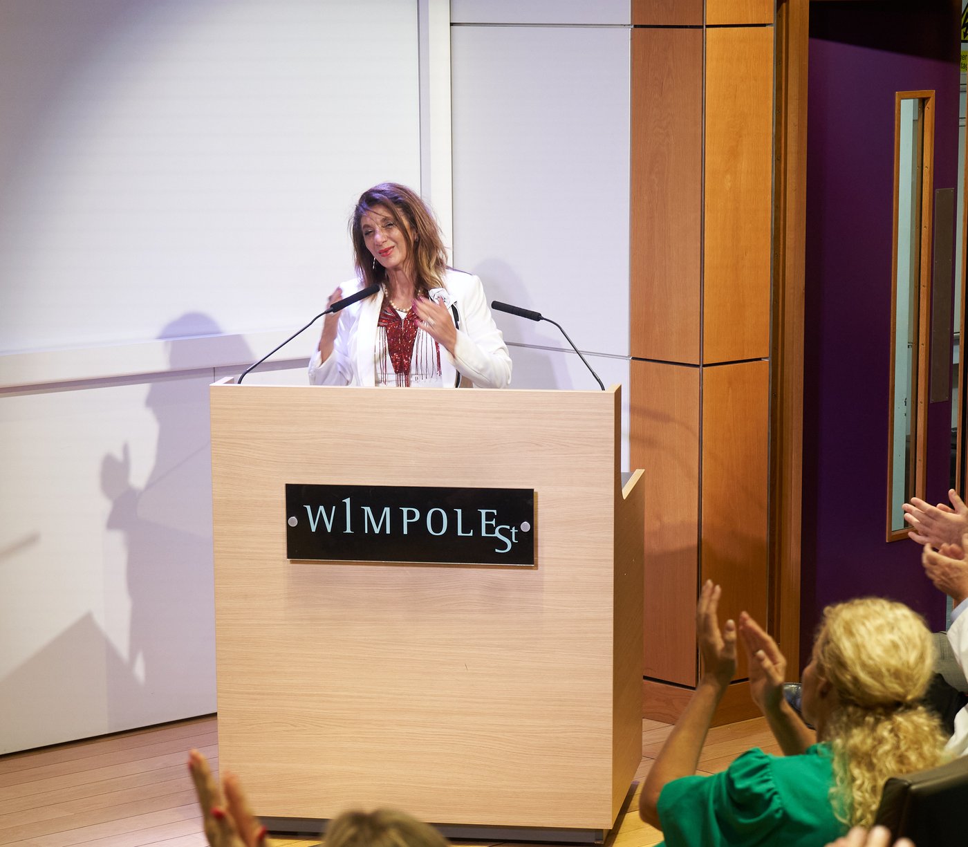 Dr. Dalal Akoury speaking on stage